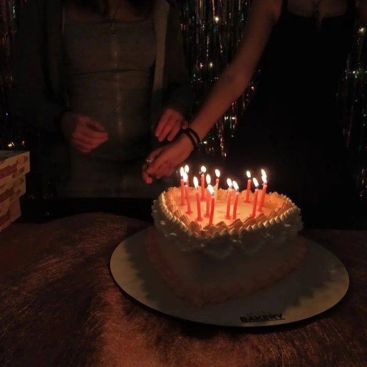 Heart-shaped birthday cake with candles
