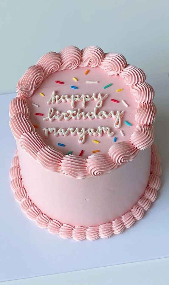 Birthday cake with pink decorations for a girl