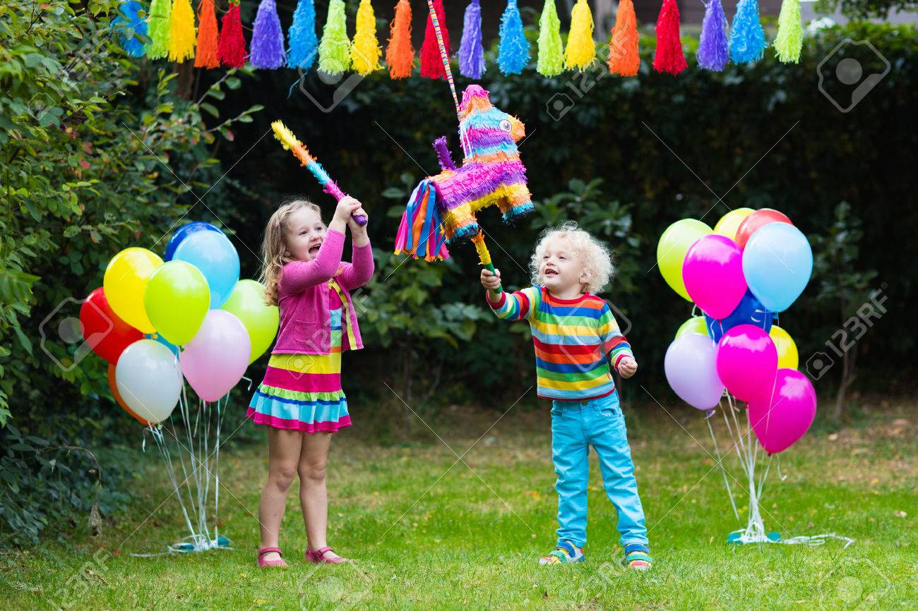 Children playing with colorful balloons at a birthday party
