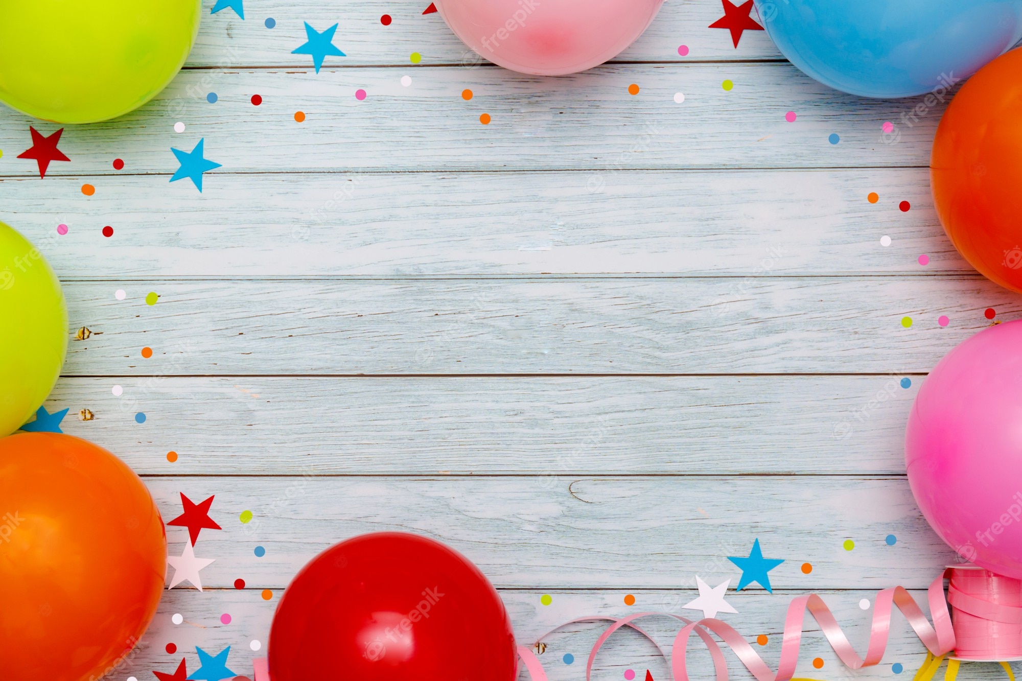 Colorful balloons and confetti on party table