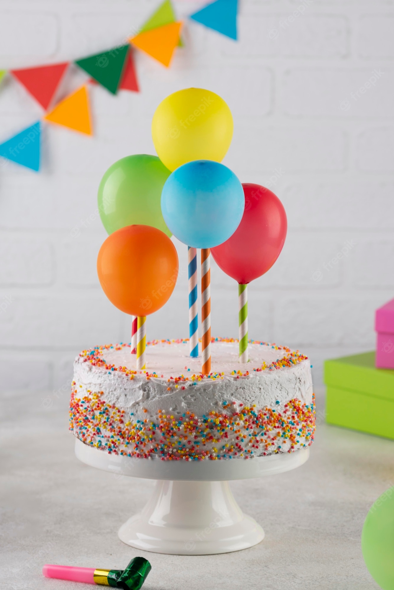 Delicious cake with colorful balloons decorations