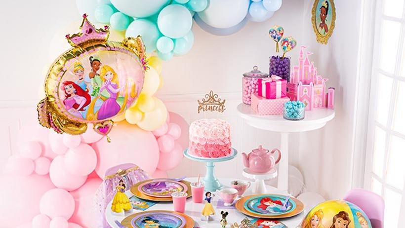 Princess-themed party decorations and cake